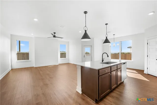 a view of kitchen with wooden floor