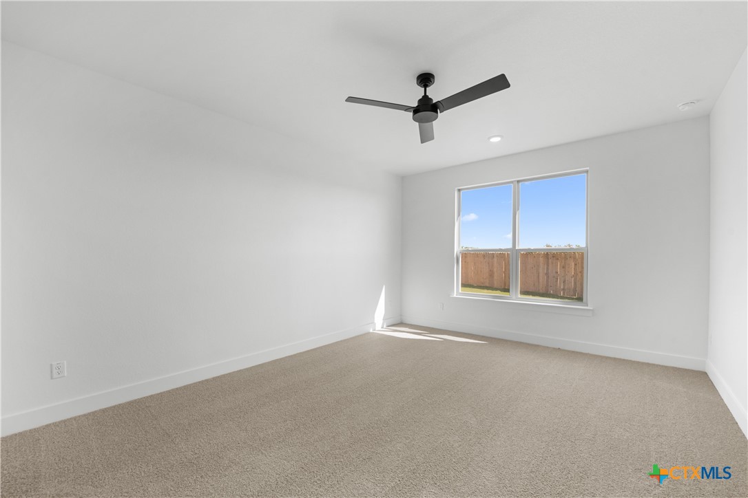 1727 Bear Grass Rdg Road Temple, TX 76501 - Photo 5 of 16 an empty room with a empty space and windows