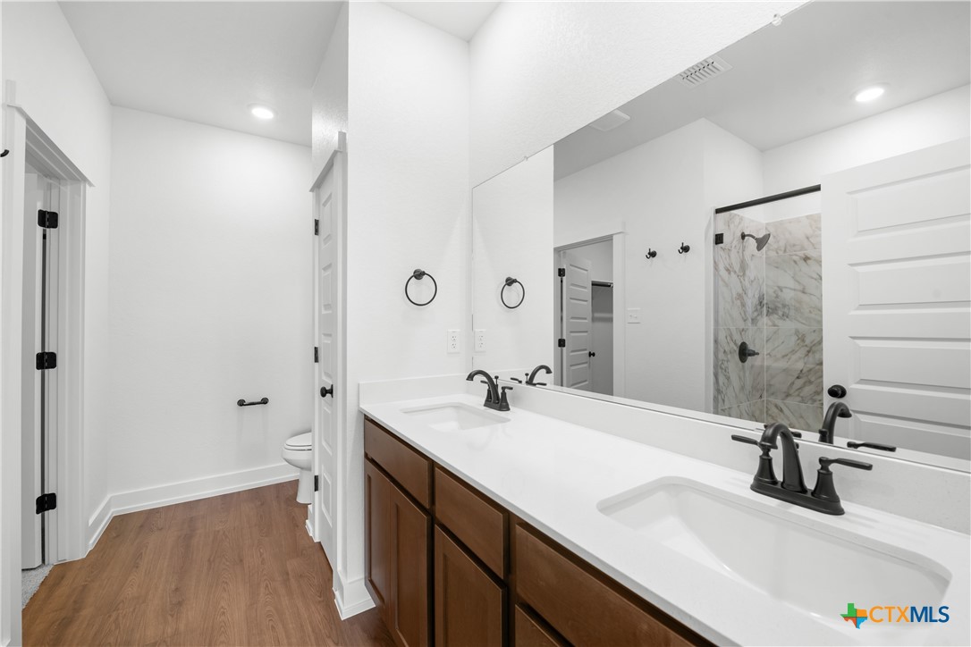 1727 Bear Grass Rdg Road Temple, TX 76501 - Photo 6 of 16 a bathroom with a sink a toilet and shower