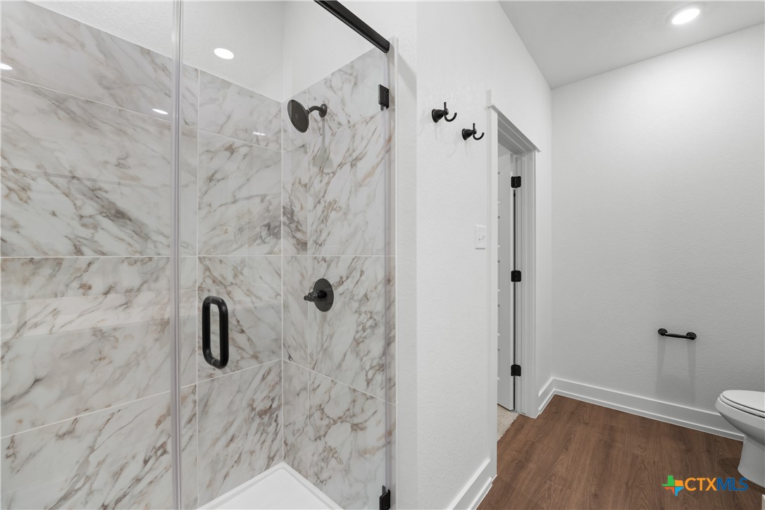 1727 Bear Grass Rdg Road Temple, TX 76501 - Photo 7 of 16 a bathroom with a shower and a toilet