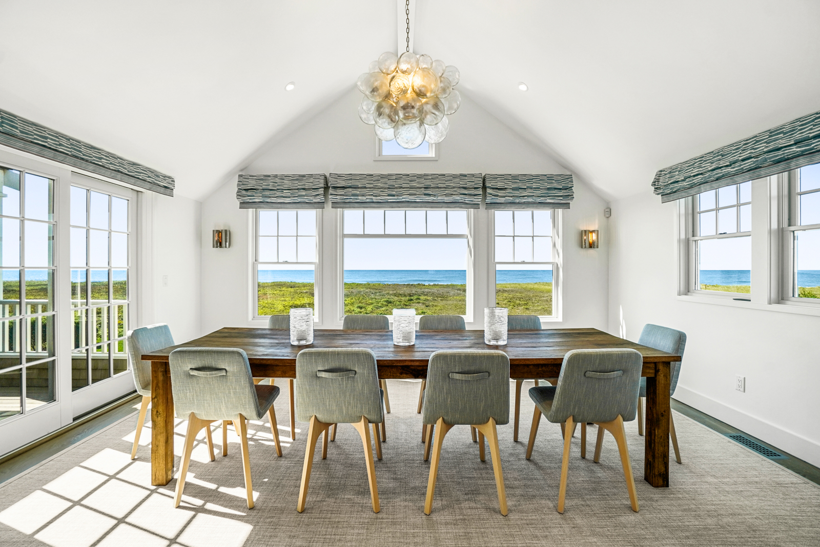 2 Marion Avenue Nantucket, MA 02554 - Photo 25 of 43 a view of a dining room with furniture a chandelier and wooden floor