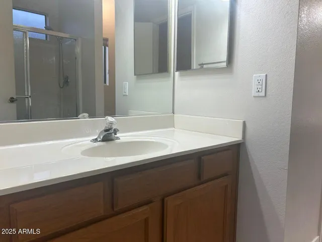 a bathroom with a sink and a mirror