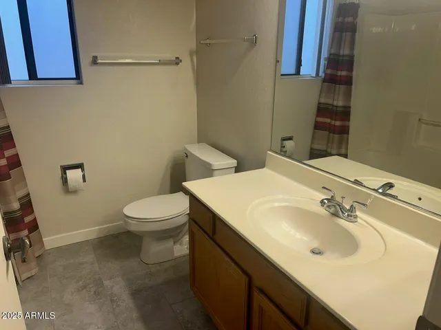 a bathroom with a bathtub and shower