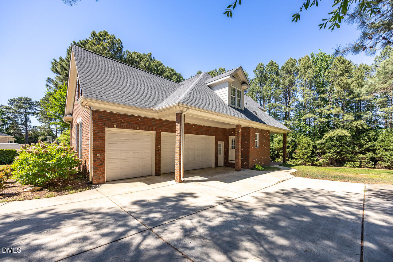 4004 Frontenac Court Apex, NC 27539 - Photo 3 of 61 a front view of a house with a yard and garage