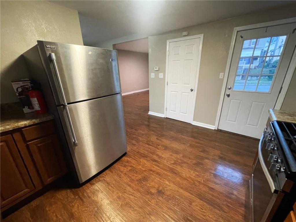 312 Jackson Avenue Vandergrift, PA 15690 - Photo 12 of 21 a view of kitchen with wooden floor and refrigerator