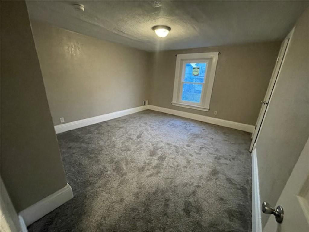 312 Jackson Avenue Vandergrift, PA 15690 - Photo 15 of 21 an empty room with windows