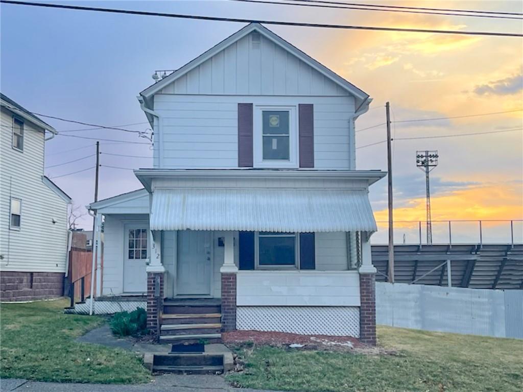 312 Jackson Avenue Vandergrift, PA 15690 - Photo 2 of 21 a front view of a house with a garden