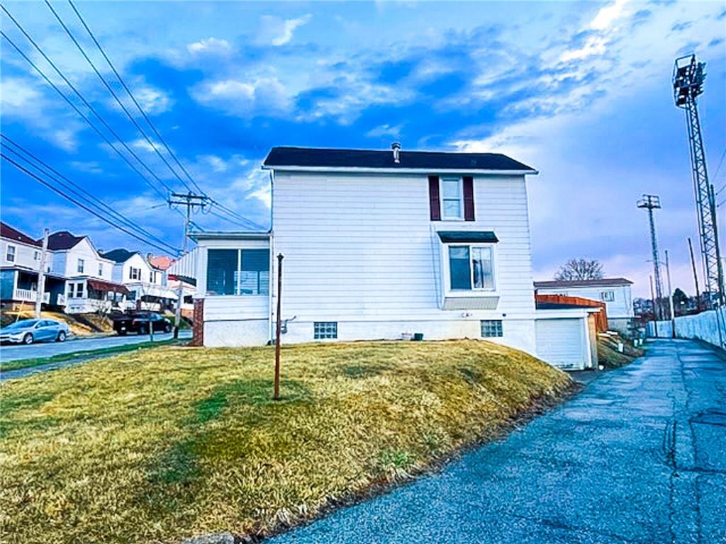 312 Jackson Avenue Vandergrift, PA 15690 - Photo 3 of 21 a view of a house with a big yard