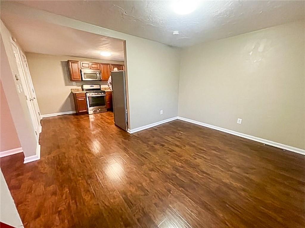 312 Jackson Avenue Vandergrift, PA 15690 - Photo 8 of 21 a view of a kitchen with wooden floor