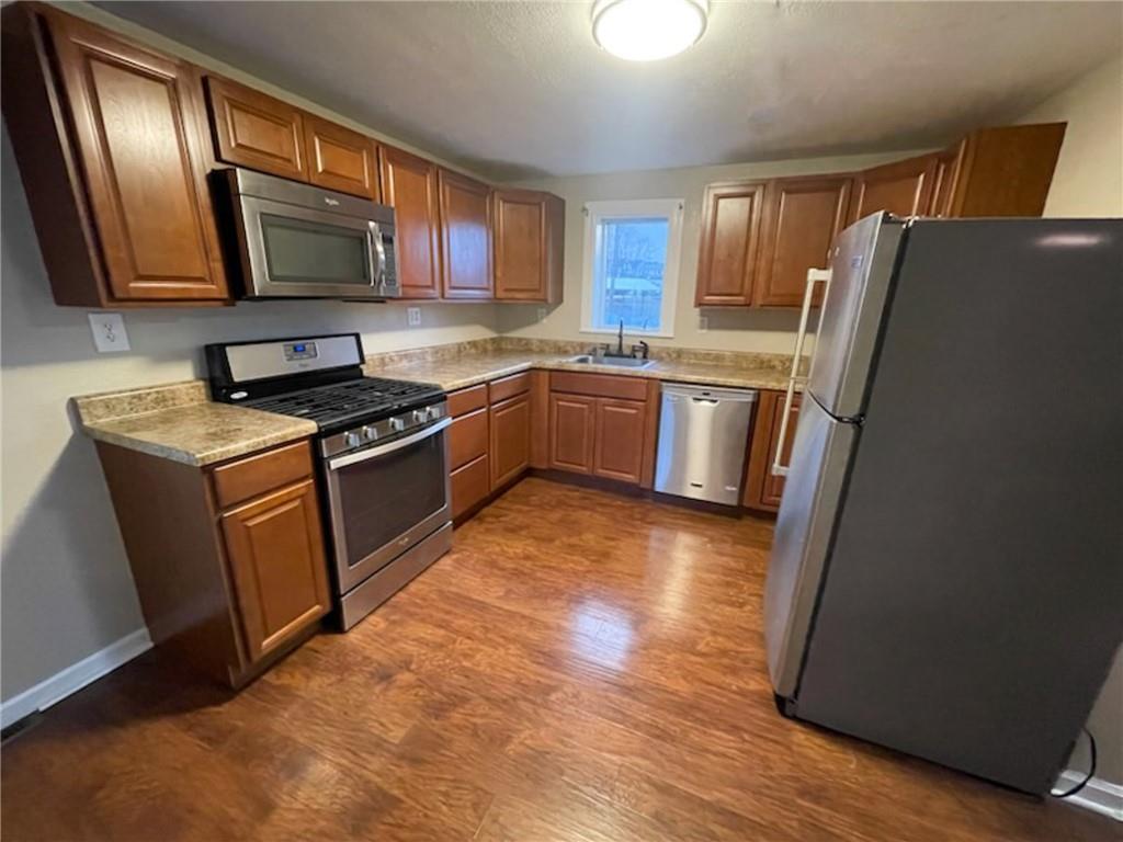 312 Jackson Avenue Vandergrift, PA 15690 - Photo 10 of 21 a kitchen with stainless steel appliances granite countertop a refrigerator stove and sink