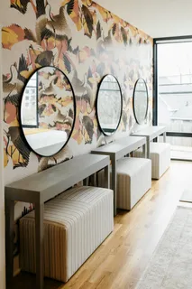 a bedroom with a bed and lamp