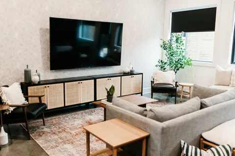 a living room with furniture and a flat screen tv