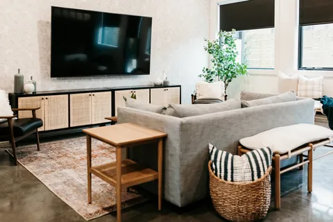 a living room with furniture and a flat screen tv