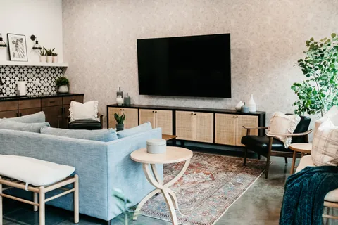 a living room with furniture and a flat screen tv