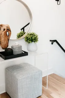 a bedroom with a bed and glass window