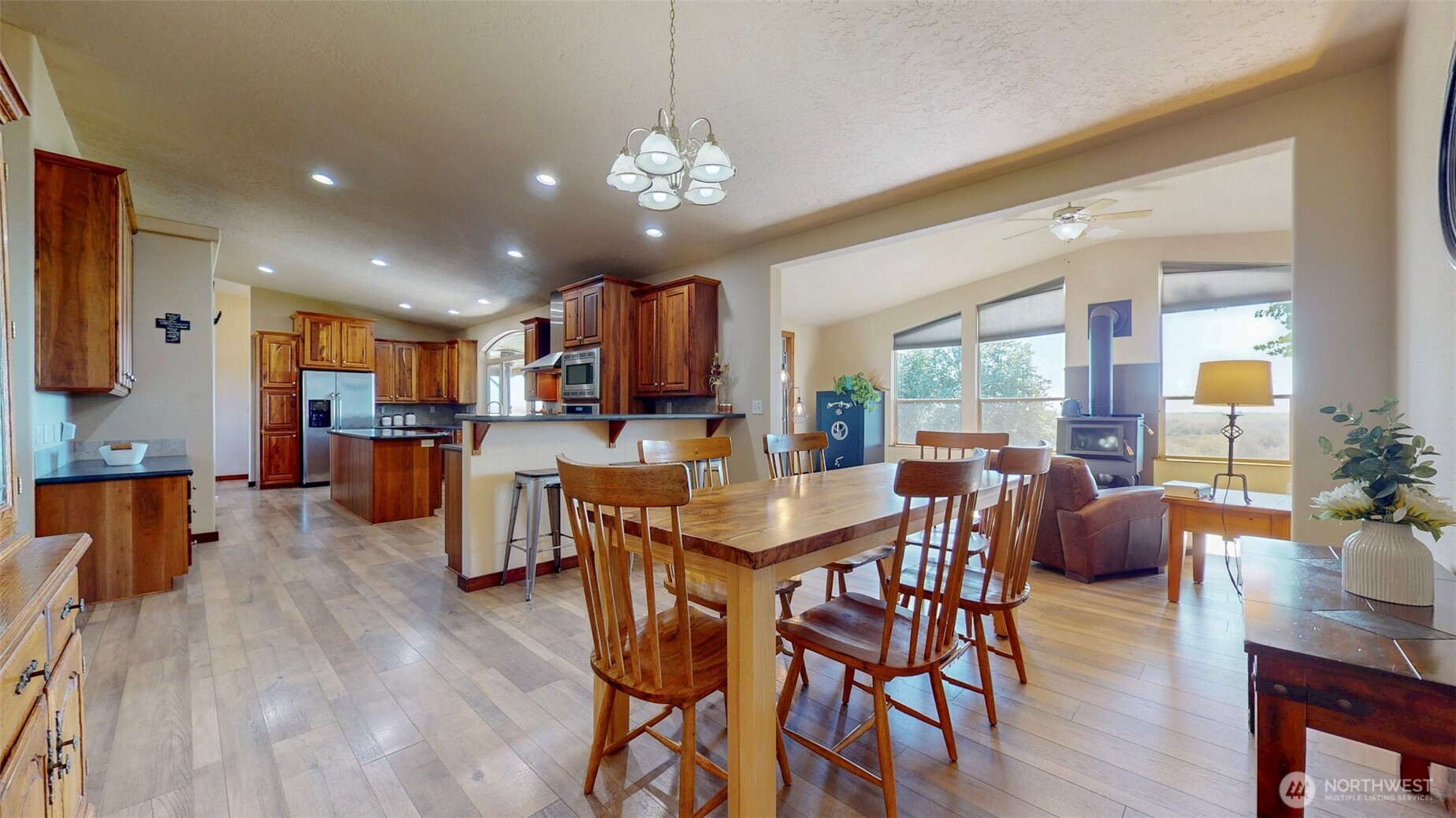 1461 Sheffield Road Mesa, WA 99343 - Photo 14 of 40 a view of a dining room with furniture window and wooden floor