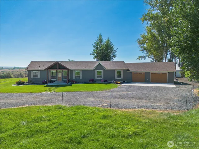 a front view of house with yard and outdoor seating