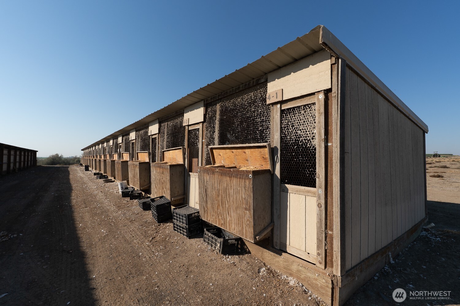 1461 Sheffield Road Mesa, WA 99343 - Photo 34 of 40 a view of a house with many windows and yard