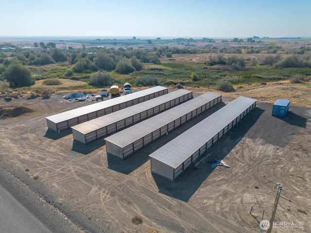 a view of a house with pool and a yard