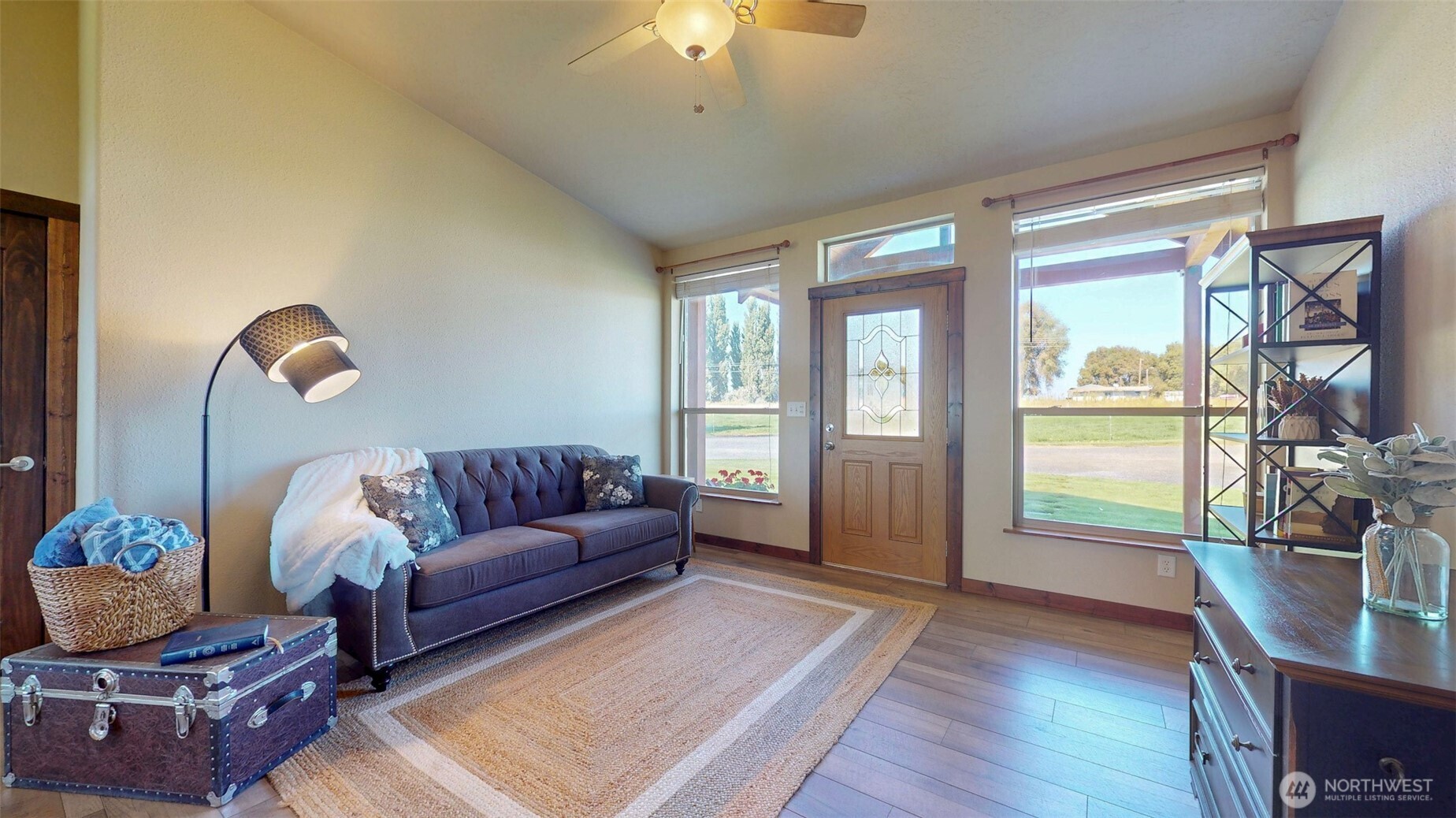 1461 Sheffield Road Mesa, WA 99343 - Photo 9 of 40 a living room with furniture a flat screen tv and a large window