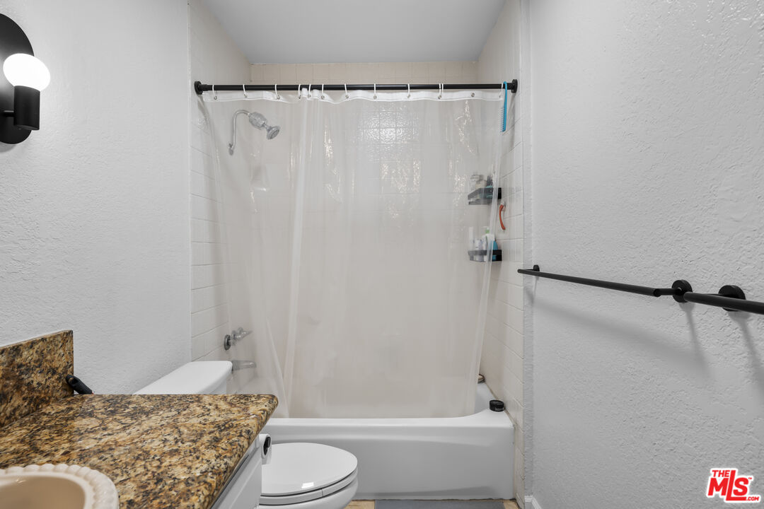 23 Buccaneer Street Marina del Rey, CA 90292 - Photo 19 of 39 a bathroom with a granite countertop bathtub shower and toilet