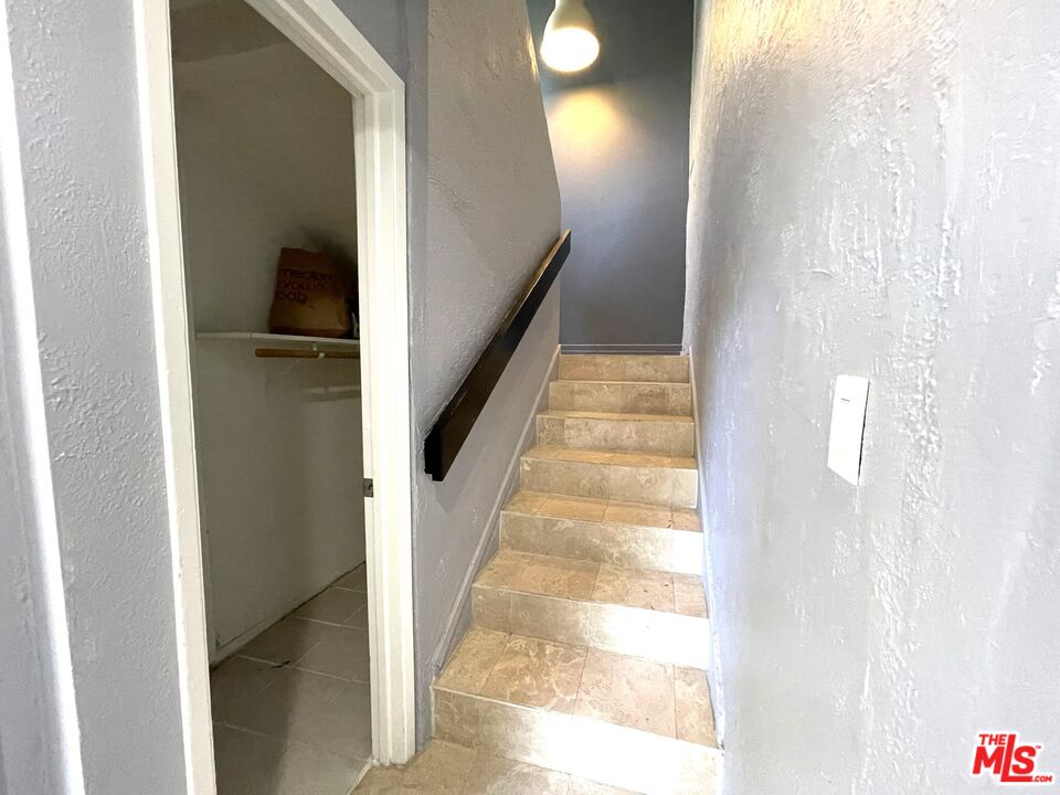 23 Buccaneer Street Marina del Rey, CA 90292 - Photo 21 of 39 a view of a hallway with wooden floor and staircase