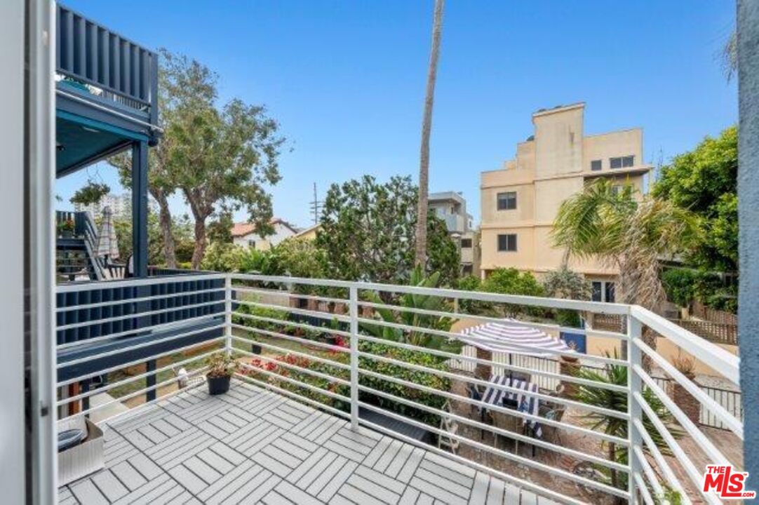 23 Buccaneer Street Marina del Rey, CA 90292 - Photo 5 of 39 a view of balcony with wooden floor and fence