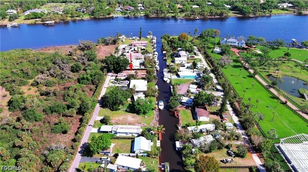 an aerial view of a houses with yard