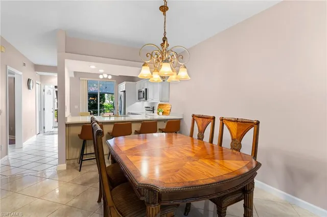 a dining room with a table chairs and a dining table