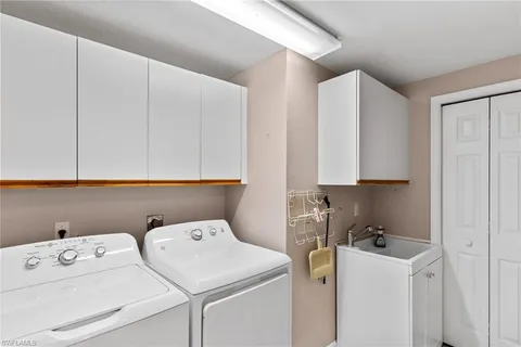 a view of storage and utility room with washer and dryer
