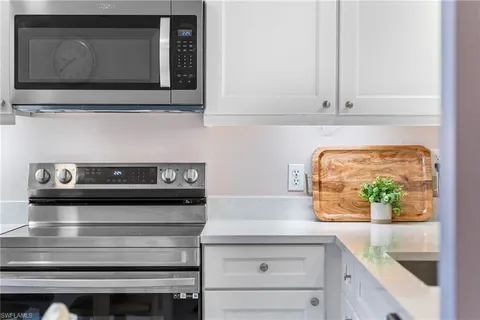 a kitchen with a stove and a microwave