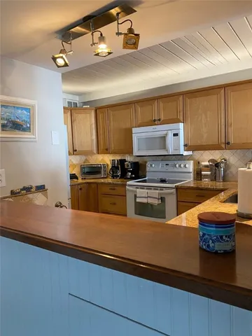a view of a room with toys and wooden floor