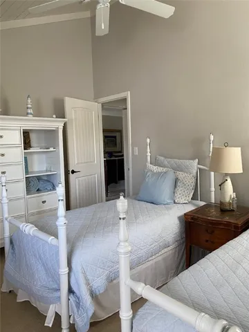 a bedroom with a bed and a lamp on table