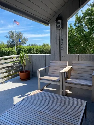 a view of a terrace with furniture