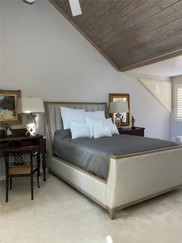 a living room with a couch and a dresser