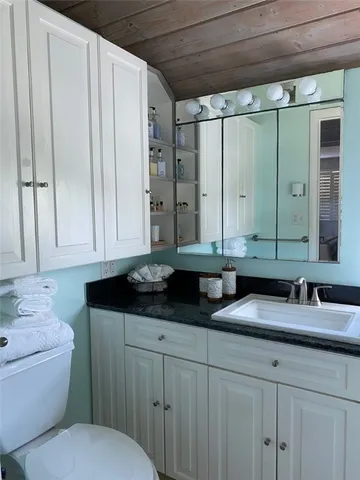 a view of swimming pool with outdoor seating