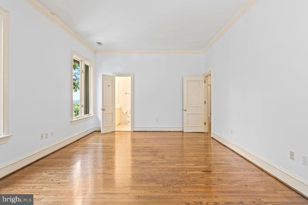 2944 University Terrace Northwest Washington, DC 20016 - Photo 33 of 41 a view of an empty room with window and wooden floor