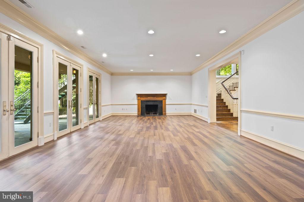 2944 University Terrace Northwest Washington, DC 20016 - Photo 37 of 41 a view of empty room with wooden floor and fireplace