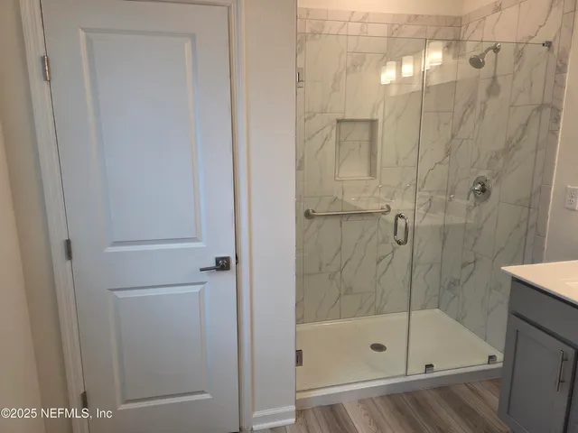 a bathroom with a shower and bathtub