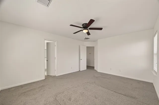 a view of room with ceiling fan