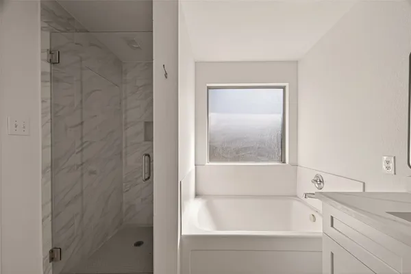 a white bath tub sitting next to a window