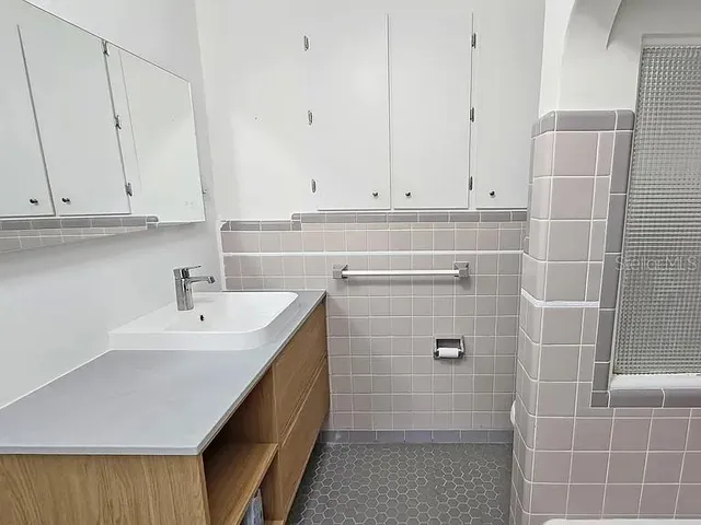 a view of a house with snow on the road