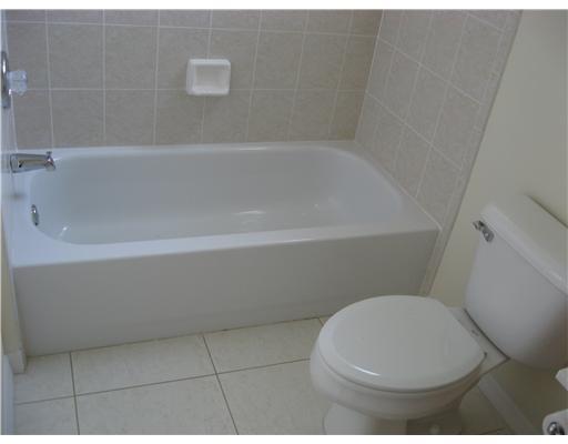 482 Northwest Emilia Way Stuart, FL 34994 - Photo 15 of 25 a bathroom with a toilet and bathtub