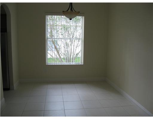 482 Northwest Emilia Way Stuart, FL 34994 - Photo 18 of 25 a view of an empty room with a window