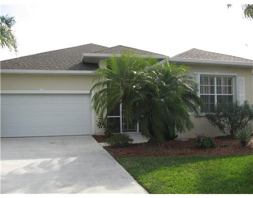 482 Northwest Emilia Way Stuart, FL 34994 - Photo 23 of 25 a view of a house with a yard and potted plants