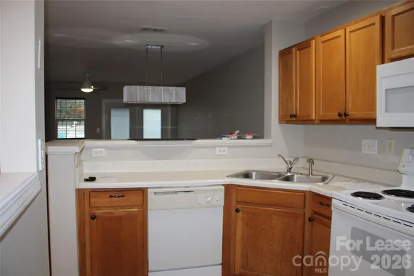 a view of a kitchen with a sink