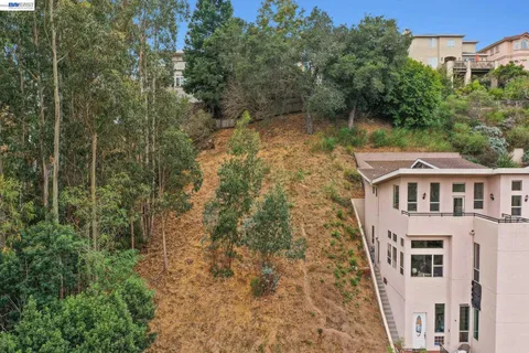 a aerial view of a house with a yard