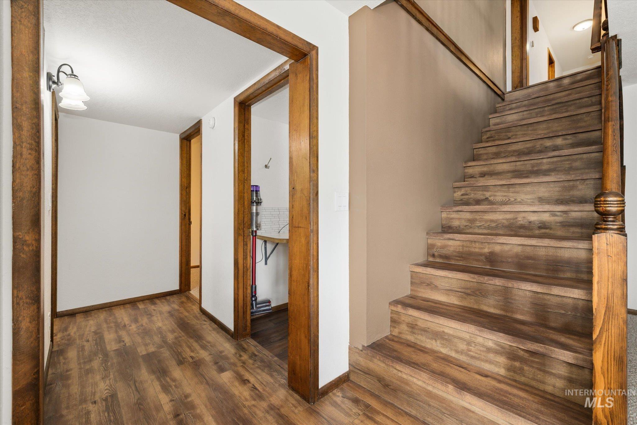 2199 South Ridge Point Way Boise, ID 83712 - Photo 33 of 50 Staircase featuring wood finished floors and baseboards