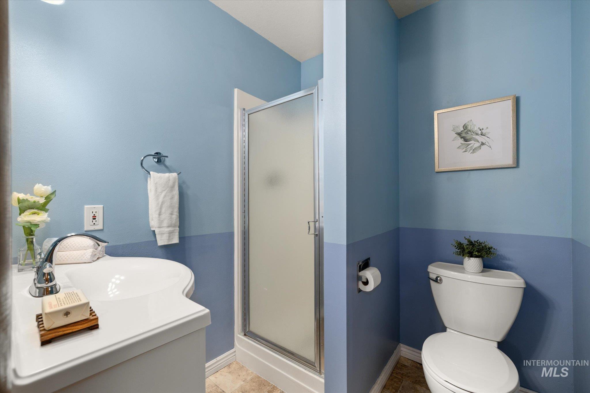 2199 South Ridge Point Way Boise, ID 83712 - Photo 37 of 50 Bathroom with a stall shower, vanity, and tile patterned floors