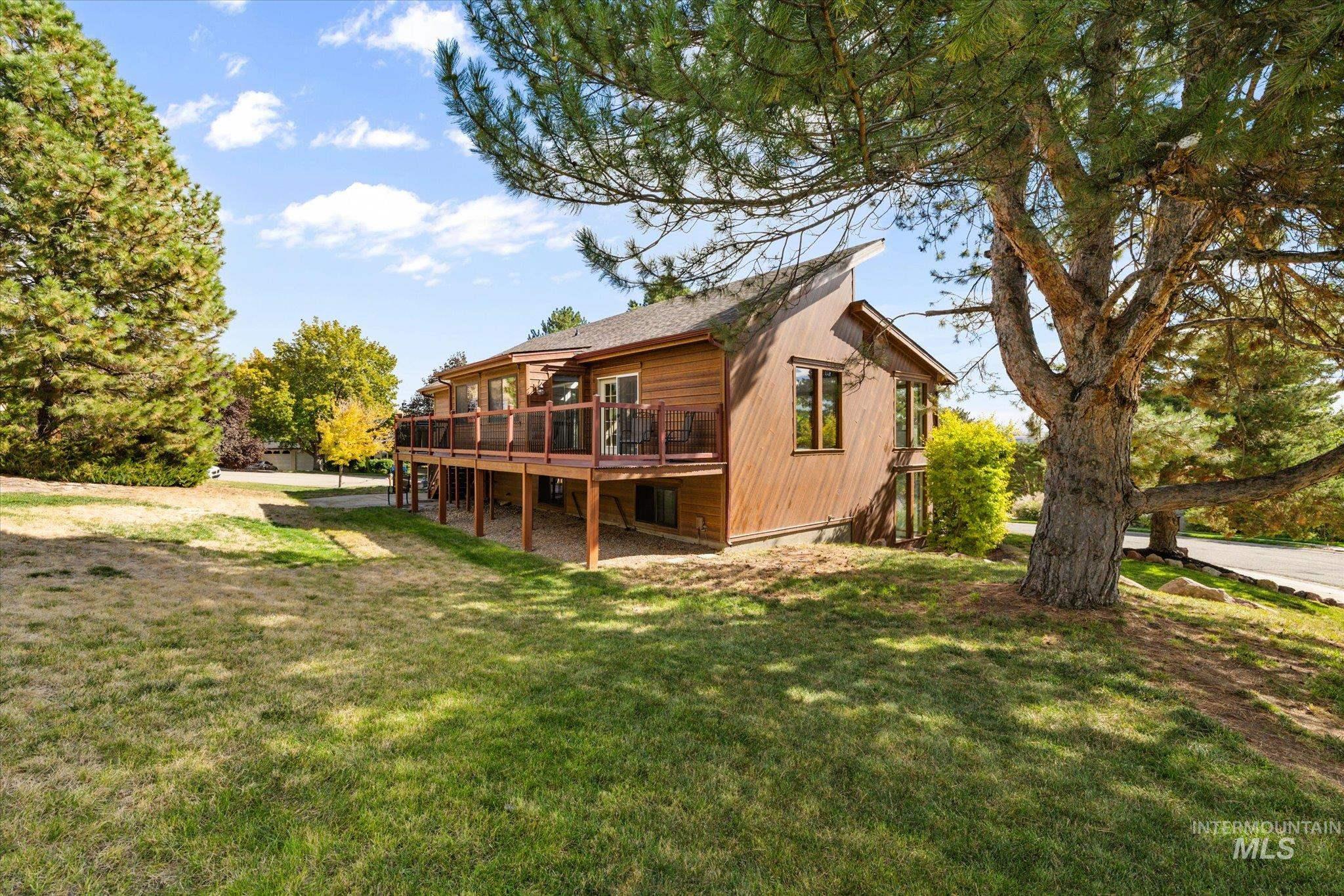 2199 South Ridge Point Way Boise, ID 83712 - Photo 41 of 50 Back of property with a lawn and a deck